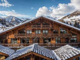 Experience luxury mountain living in this stunning wooden chalet, nestled amidst snow-capped peaks and evergreen forests.