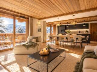 Experience luxury mountain living in this stunning alpine retreat, featuring a spacious open-plan living area with a modern kitchen and dining space.