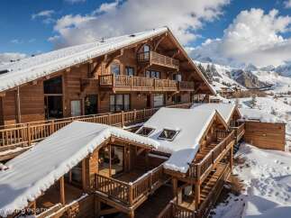 Experience luxury mountain living in this stunning wooden chalet, nestled amidst snow-covered peaks and pristine winter landscapes.
