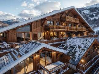 Experience luxury mountain living in this stunning wooden chalet, nestled amidst snow-capped peaks and evergreen forests.