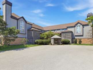 Discover this charming property featuring a unique architectural design with a prominent chimney and a welcoming gazebo.