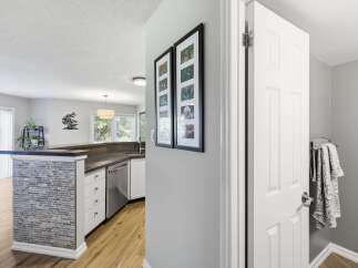 Discover a beautifully updated kitchen featuring a stylish tiled island and sleek countertops, perfect for meal preparation and entertaining.