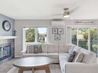 Experience comfortable living in this inviting living room, featuring a plush sectional sofa perfect for relaxation and entertainment.