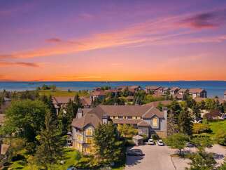 Experience breathtaking sunset views over the water from this stunning property.