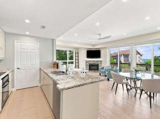 Experience breathtaking lake views from this stunning open-concept living space, perfect for entertaining.