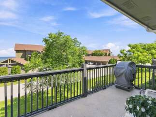 Enjoy outdoor living on this spacious balcony, perfect for entertaining or relaxing with a view.