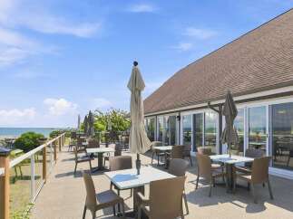 Enjoy breathtaking ocean views from this stunning patio, perfect for al fresco dining or relaxing with a drink.