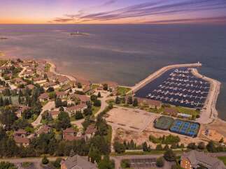 Experience waterfront living at its finest with this stunning aerial view of a resort-style community.
