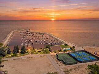 Experience luxury waterfront living with this stunning property featuring a private marina and breathtaking sunset views.