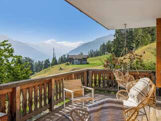 Enjoy breathtaking mountain views from this charming balcony, perfect for your morning coffee or evening relaxation.