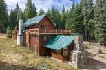 Nestled amidst a serene forest, this charming log cabin offers a rustic retreat with modern comforts.