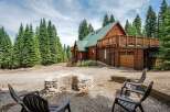 Escape to this stunning log cabin nestled amidst towering pine trees, offering a serene mountain retreat.