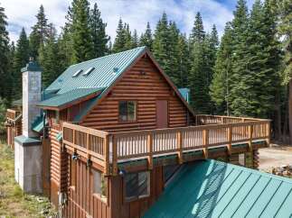 Experience rustic charm in this stunning log cabin nestled amidst a serene forest.