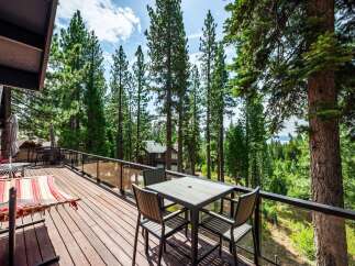 Enjoy breathtaking mountain and lake views from this expansive deck, perfect for outdoor living and entertaining.