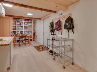 Discover ample storage solutions in this versatile space, featuring extensive shelving units perfect for organizing belongings.