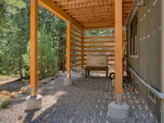 This property features a covered outdoor area with a Generac generator, providing reliable backup power.
