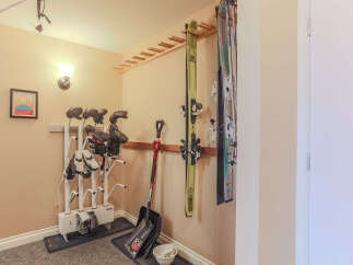 This property offers convenient storage solutions for outdoor enthusiasts, featuring a dedicated ski and boot rack.