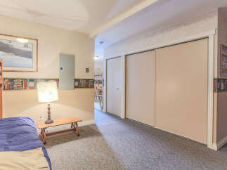 This charming bedroom features a cozy bunk bed setup, perfect for family or guests.
