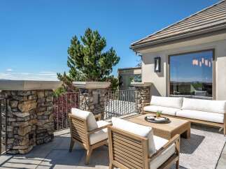 Enjoy breathtaking views from this stunning outdoor living space, featuring a spacious patio perfect for entertaining.