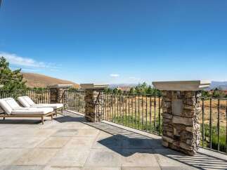 Enjoy breathtaking panoramic views from this expansive balcony, perfect for entertaining or quiet relaxation.