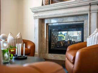 Cozy up by the elegant fireplace, a stunning focal point in this inviting living space.