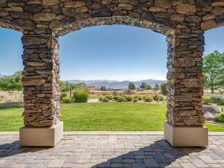 Step through this magnificent stone archway to reveal a breathtaking view of rolling hills and distant mountains.