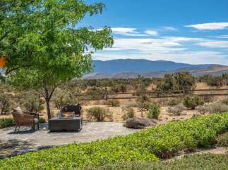 Experience breathtaking mountain views from this stunning outdoor living space.