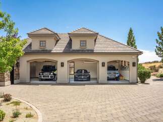 This stunning property boasts a spacious three-car garage, perfect for housing your luxury vehicle collection.