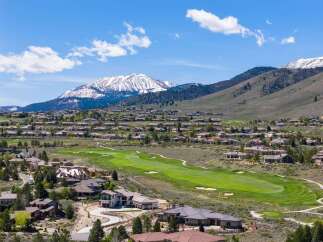 Experience luxury living with stunning mountain views and a pristine golf course right at your doorstep.