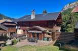 Experience mountain living in this charming wooden chalet, perfect for a getaway.