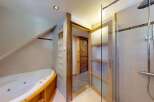 Indulge in relaxation with this luxurious bathroom featuring a spacious jacuzzi tub perfect for unwinding after a long day.