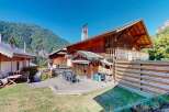 Experience mountain living in this charming wooden chalet, featuring a spacious outdoor deck perfect for entertaining or enjoying the serene surroundings.