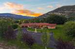 Experience breathtaking mountain views from this stunning ranch-style home, perfectly situated at the base of majestic peaks.