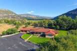 Nestled amidst breathtaking mountain scenery, this expansive ranch-style home offers a serene retreat.