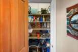 Discover ample storage solutions in this charming pantry, perfect for organizing your home essentials.