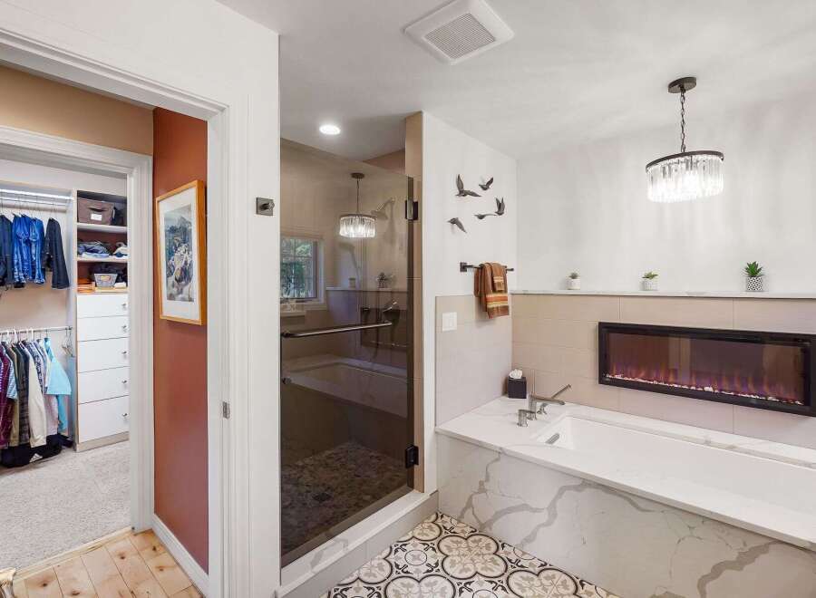 Experience luxury and comfort in this stunning master bathroom, featuring a spacious walk-in closet and a spa-like soaking tub.