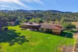 Discover this stunning property nestled against a scenic hillside, offering a perfect blend of indoor and outdoor living.