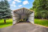 Discover ample storage and protection with this spacious metal carport, perfect for housing vehicles, equipment, or recreational gear.