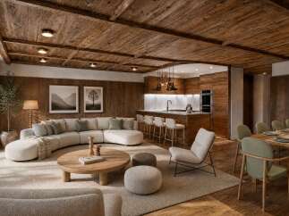 Experience luxurious mountain living in this stunning open-concept living space, featuring a modern sectional sofa, a sleek kitchen island, and a rustic wooden ceiling.