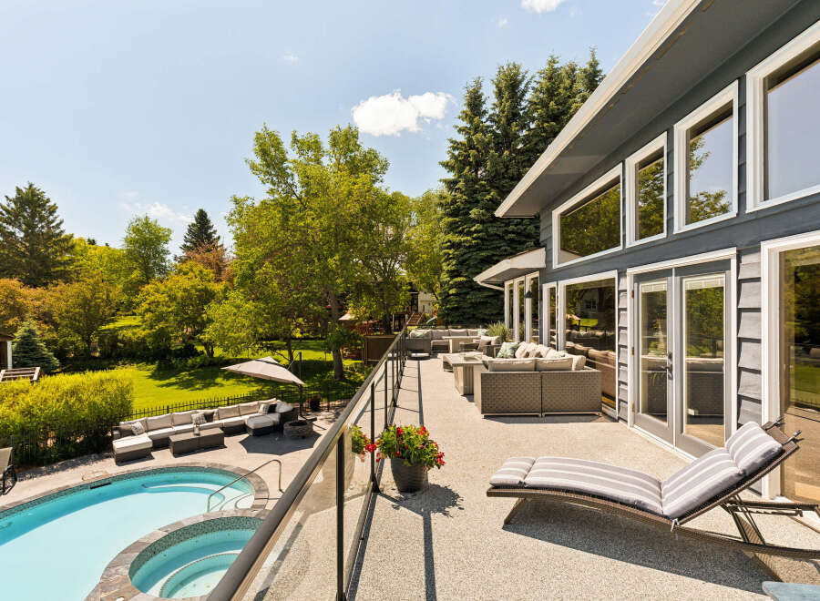 Experience luxurious outdoor living with this stunning property featuring a sparkling pool and spa, perfect for relaxation and entertainment.