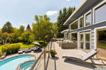 Experience luxurious outdoor living with this stunning property featuring a sparkling pool and spa, perfect for relaxation and entertainment.