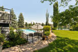 Enjoy resort-style living in this stunning backyard oasis, complete with a sparkling swimming pool and a cozy fire pit perfect for evening gatherings.