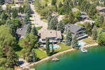 Experience luxury waterfront living in this stunning estate, boasting a private pool and direct lake access.
