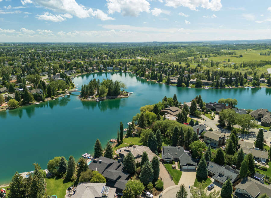 Experience luxury lakeside living in this stunning aerial view of a waterfront community.