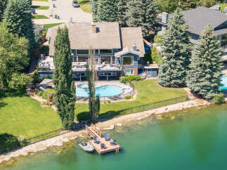 Experience luxury waterfront living in this stunning property featuring a private dock and boat access.