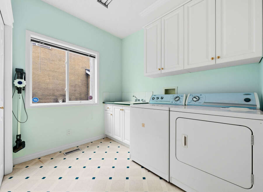 Discover a functional laundry room featuring a washing machine and dryer, perfect for managing household chores.