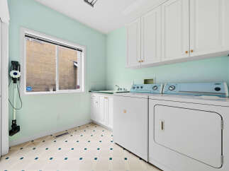 Discover a functional laundry room featuring a washing machine and dryer, perfect for managing household chores.