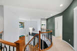 This stunning home features a grand staircase with a beautiful chandelier, perfect for making an entrance.
