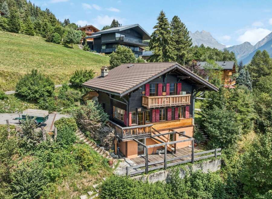 Nestled amidst lush greenery and offering breathtaking mountain views, this charming chalet boasts traditional alpine architecture with modern comforts.
