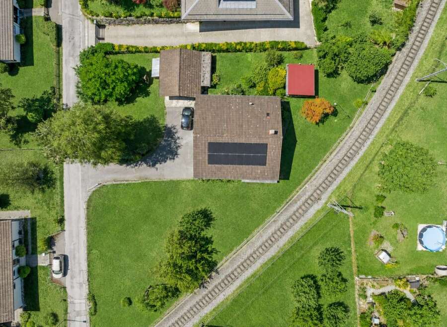 Discover this charming property featuring a well-maintained house with solar panels on the roof, perfect for sustainable living.